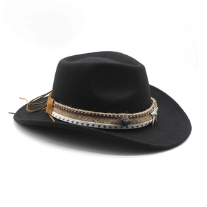 Detail of black felt cowboy hat with braided strap and turquoise star concho accent