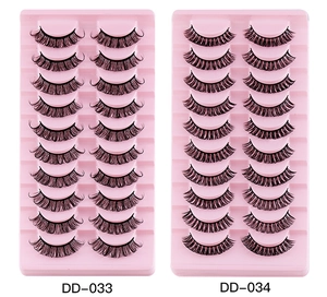 Close-up of black DD volume false eyelashes in DD-033 and DD-034 styles with pink trays
