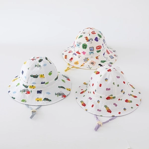 Detail view of cotton kids bucket hats with cartoon car and building block patterns