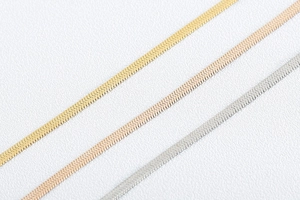 Detailed comparison of flat snake chains in gold, rose gold, and silver finishes