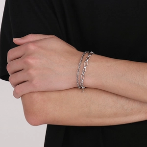 Detail of silver double-layered titanium steel chain bracelet showing layered link textures