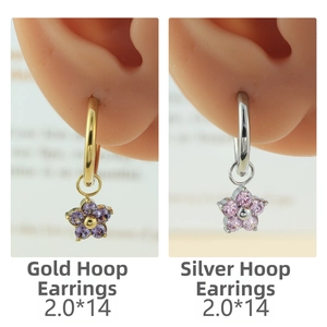 Detail of flower zircon charms on gold and silver hoop earrings, size 2.0*14 mm