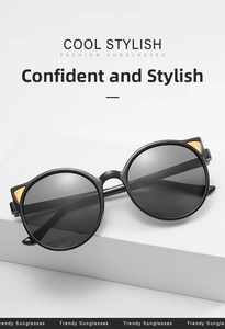 Detail of round cat ear sunglasses with black frames and gold metal accents for kids