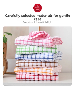 Close-up of neatly folded colorful checkered cotton tea towels with textured fabric detail