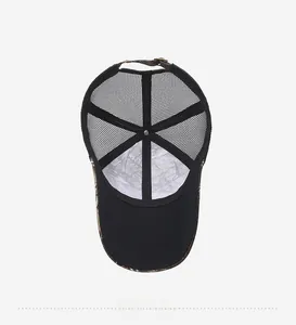 Detail view of the breathable mesh interior and adjustable strap of the camo baseball cap