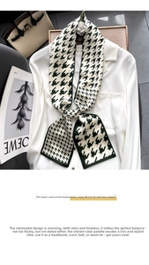 Detail of green houndstooth skinny silk scarf tied on a white shirt collar