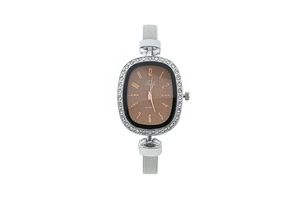 Detail of oval quartz watch with brown dial, rhinestone bezel and silver mesh strap