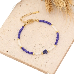 Bohemian beaded bracelet with blue stone heart and gold stainless steel lobster clasp