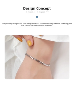 Detail shot of the polished s925 sterling silver flat Cuban link bracelet on a wrist
