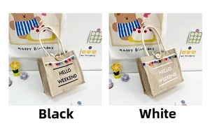 Detail of linen tote bags with colorful pompoms and wooden buttons in black and white styles