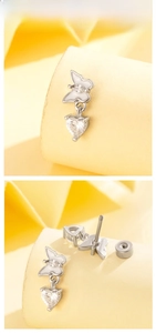 Macro detail of butterfly heart cartilage stud with cubic zirconia and screw back
