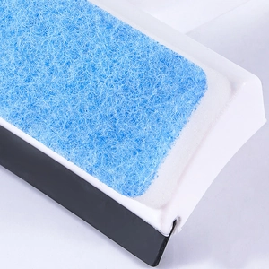 Blue glass window wiper with fiber brush and black scraper on white background