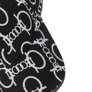 Detail of baseball cap fabric with chain print and precision stitching on the brim