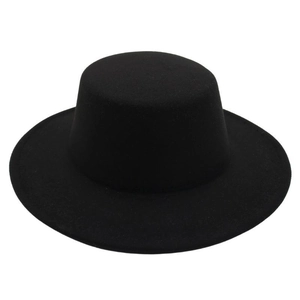Detailed view of the structured crown and flat brim on this black wool boater hat