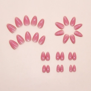 Detail view of pink gradient cat-eye press-on nails with shimmering glitter finish