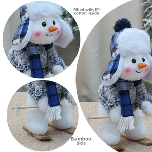 Detail of plush snowman doll with soft PP cotton filling and natural bamboo skis