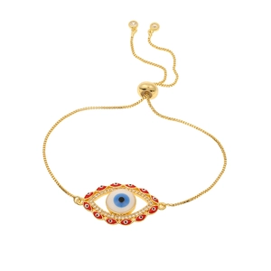 Macro shot of gold-plated evil eye bracelet with blue enamel and CZ crystal details