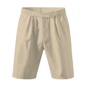 Detail of beige linen shorts featuring an elastic drawstring waist and textured fabric