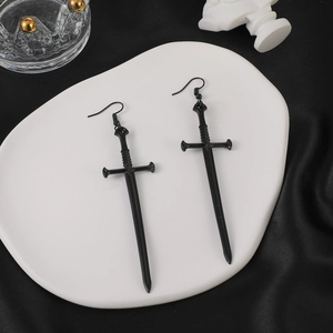 Gothic black dagger sword earrings with hook style design on a white decorative tray