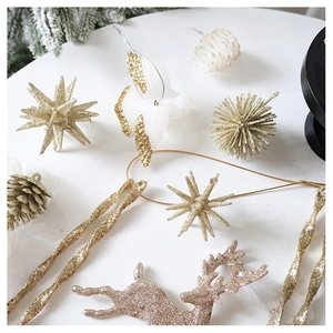 Close-up of champagne gold glitter reindeer and pine cone ornaments for Christmas decor