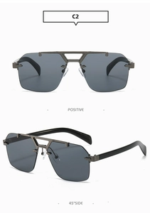 Detail view of square rimless sunglasses with gunmetal double bridge and dark grey lenses