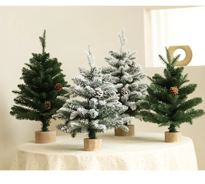 Mini artificial Christmas trees with pine cones and wooden bases on a polka dot tablecloth