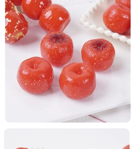 Macro view of artificial candied hawthorn with shiny syrup glaze and white sesame seeds
