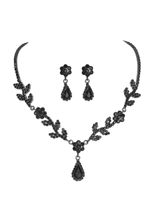 Macro shot of luxurious black rhinestone floral necklace and teardrop earrings set