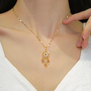 Luxurious gold feather tassel dreamcatcher necklace with sparkling crystals for women