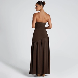 Detail showing the elegant backless design and flowing streamers of the brown tube dress