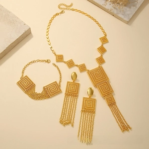 Detailed view of gold-plated double-layer tassel necklace and earring jewelry set