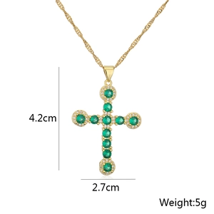 Detail shot of 18K gold plated cross pendant with green gemstone, 4.2cm height, 5g weight