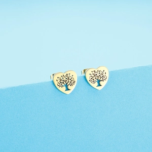 Macro view of gold heart stud earrings featuring a delicate tree of life cutout design