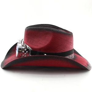 Detail of red and black gradient straw cowboy hat with silver retro goggles decoration