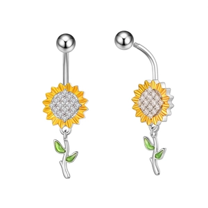 Macro detail of sunflower belly rings with yellow petals, zircon centers and green leaves