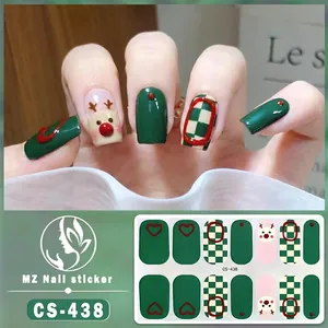 Detailed view of Christmas nail wraps featuring reindeer, red-green plaid, and heart patterns