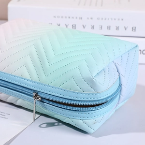 Gradient pink-to-blue PU leather makeup bag with wave embossed texture and blue zipper