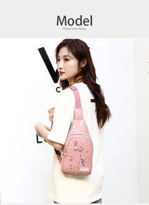 Detail of pink crossbody bag in waterproof nylon with colorful paint splash design