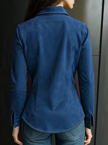 Close-up of the back seam and soft brushed fabric texture on a navy blue long sleeve polo shirt