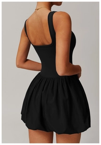 Detail of square open back and bubble hem design on this black athletic mini dress
