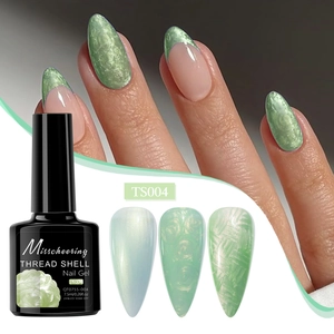 Detail view of TS004 light green pearl shell thread gel nail polish on nails and color swatches