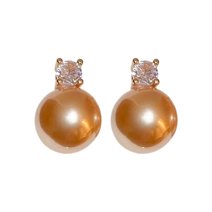 Elegant gold pearl stud earrings with sparkling round zircon in a minimalist French style