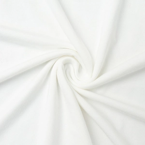 Vue macro de la texture du tissu en satin blanc avec des motifs tricotés doux