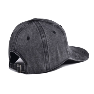 Detail view of washed cotton baseball cap with adjustable metal buckle and breathable eyelets
