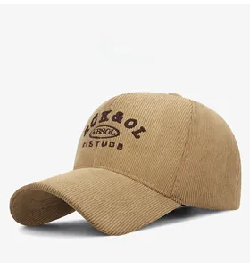 Detail of corduroy baseball cap with letter embroidery and textured fabric finish