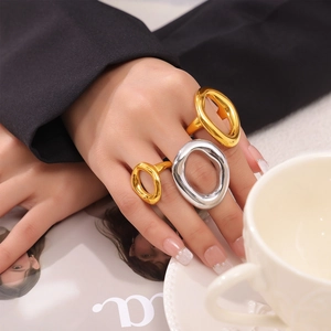 Irregular hollow geometric ring in gold and silver finish with polished stainless steel look