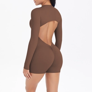Macro detail of dark brown ruched back and open back cutout on yoga bodysuit