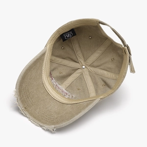 Inside view of khaki cotton baseball cap with vintage frayed brim and adjustable strap