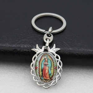 Silver metal keychain featuring Our Lady of Guadalupe oval pendant with braided border