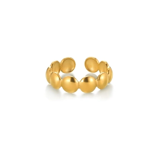 Detail view of gold beaded stainless steel ring with polished sphere texture design